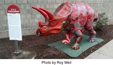 picture of the DNAsaurus dinosaur - DNAsaurus_11_DNAsaurus_with%20sign%20cropped.jpg